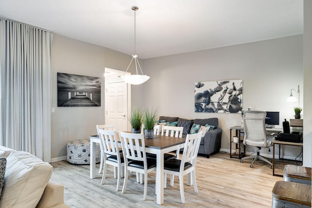 dining area with light wood-type flooring