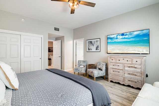 bedroom featuring a closet, ceiling fan, and light wood-type flooring