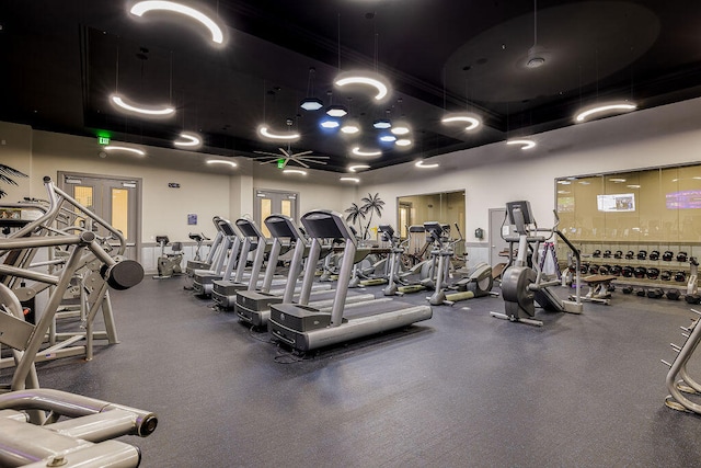 gym featuring french doors and ceiling fan