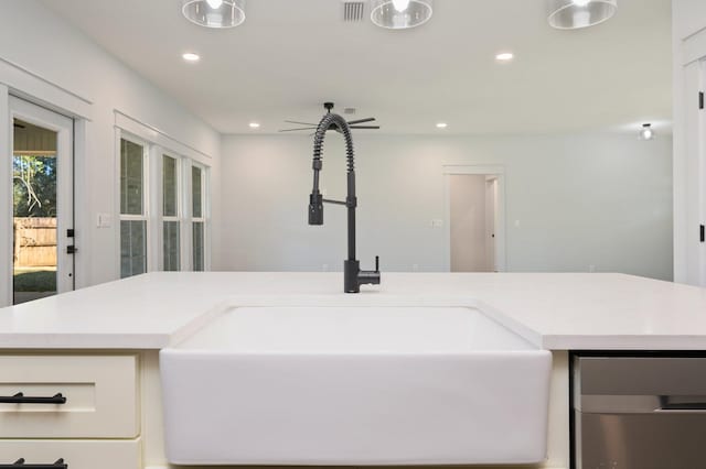 bathroom with ceiling fan and sink