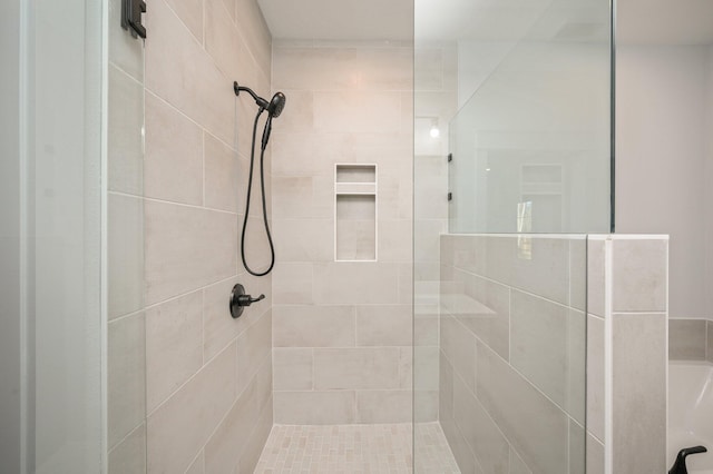 bathroom with a tile shower