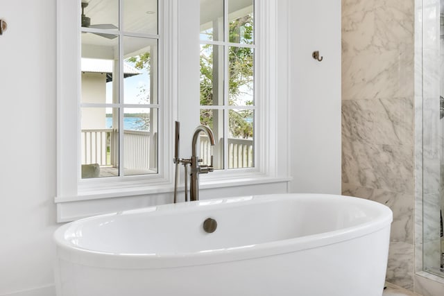 bathroom with sink, plenty of natural light, and shower with separate bathtub