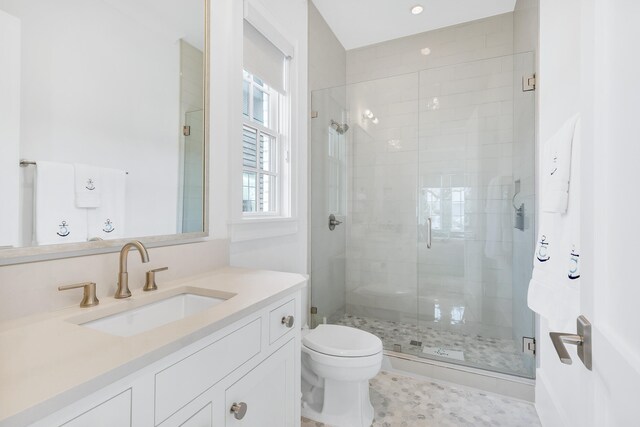 bathroom with walk in shower, toilet, tile flooring, and large vanity