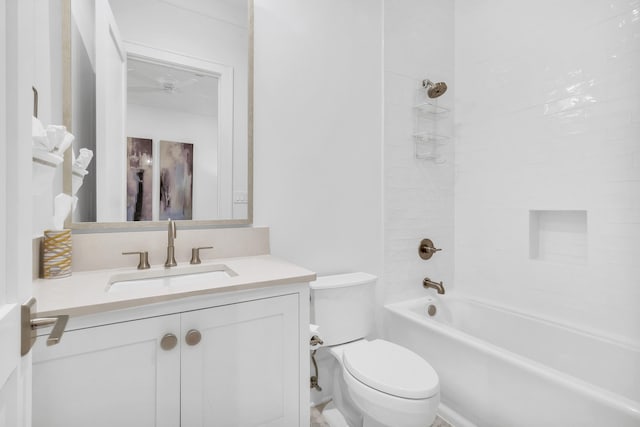 full bathroom with tiled shower / bath combo, vanity, and toilet