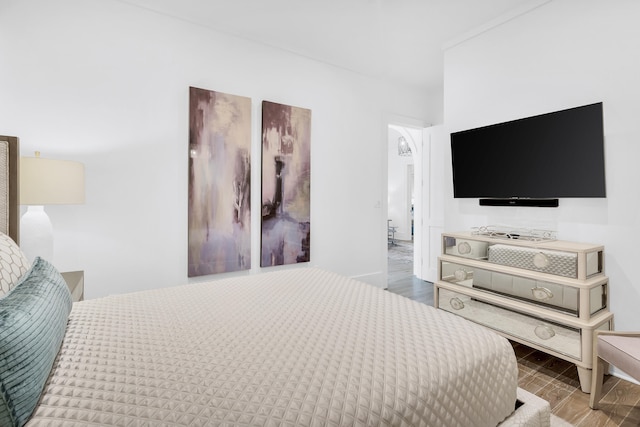 bedroom featuring dark hardwood / wood-style flooring