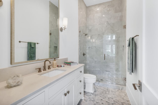 bathroom with walk in shower, large vanity, toilet, and tile flooring