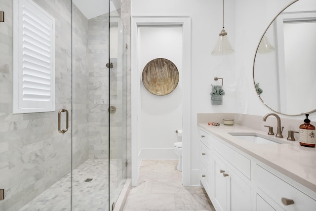 bathroom featuring tile flooring, oversized vanity, a shower with door, and toilet