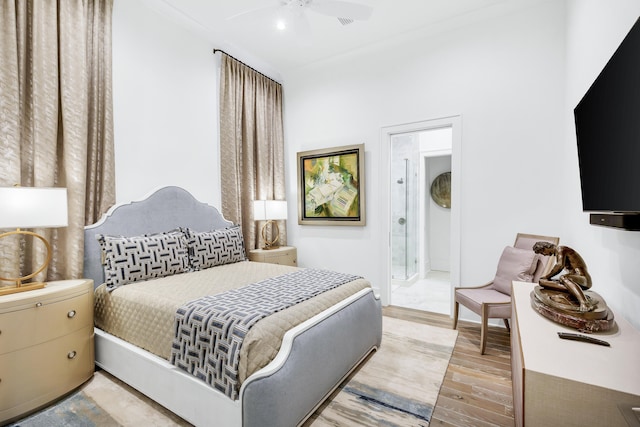 bedroom with light hardwood / wood-style floors and ceiling fan