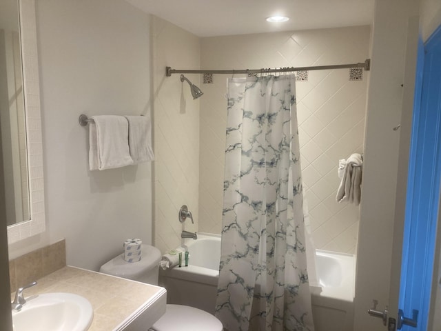 full bathroom featuring shower / tub combo, toilet, and vanity