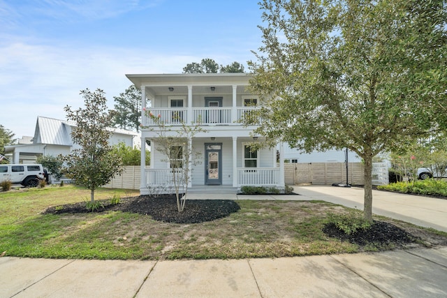 view of front of home featuring a balcony and covered porch