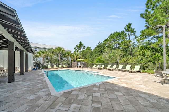 view of swimming pool featuring a patio