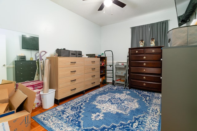 bedroom with wood-type flooring and ceiling fan