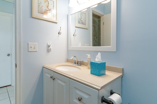 bathroom with tile flooring and vanity