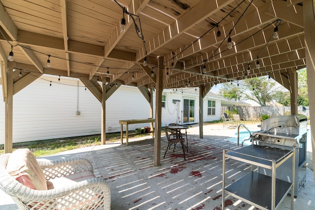 wooden deck with a patio area and area for grilling