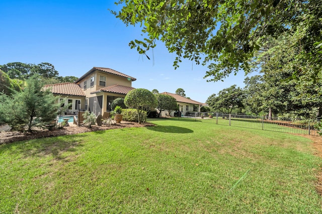 view of yard with a fenced in pool