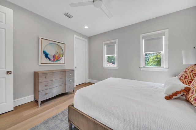 bedroom featuring light hardwood / wood-style flooring and ceiling fan