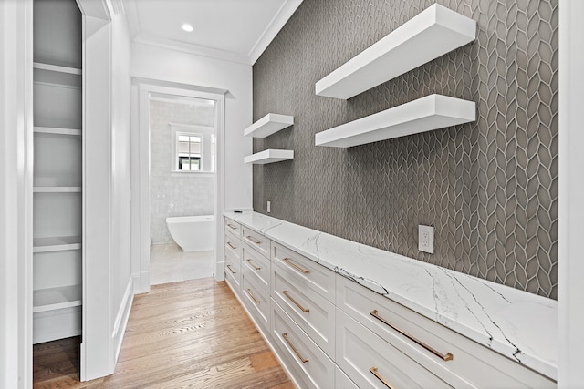 spacious closet featuring light hardwood / wood-style floors