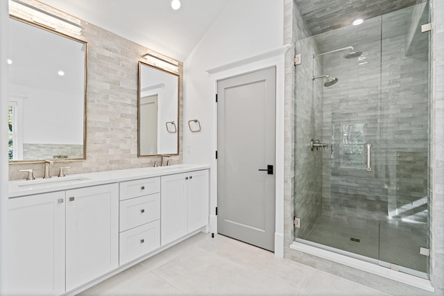 bathroom with lofted ceiling, an enclosed shower, vanity, tile patterned flooring, and backsplash