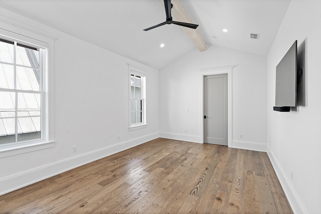 unfurnished room featuring vaulted ceiling with beams, ceiling fan, and light hardwood / wood-style flooring