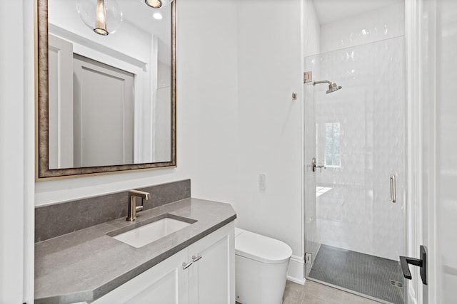 bathroom featuring a shower with shower door, toilet, vanity, and tile patterned floors