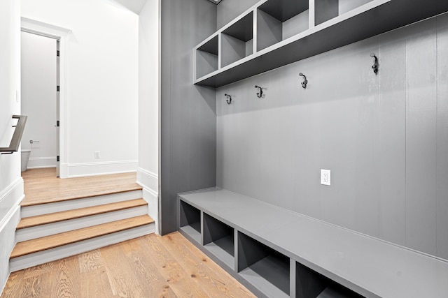 mudroom with light hardwood / wood-style floors