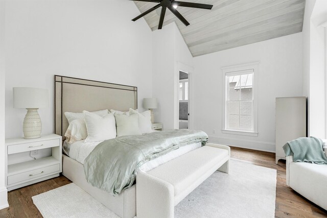 bedroom with ceiling fan, lofted ceiling, wooden ceiling, and dark hardwood / wood-style flooring