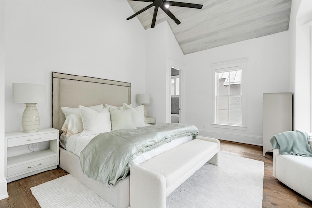 bedroom featuring ceiling fan, wood-type flooring, and vaulted ceiling