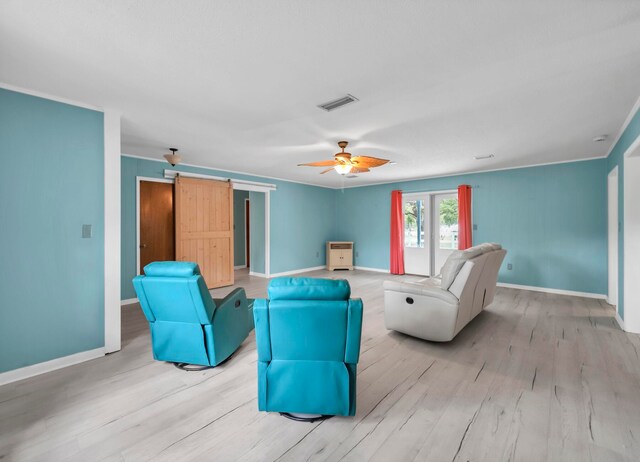 living room featuring ceiling fan and light wood-type flooring