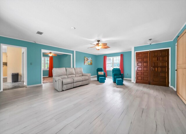 unfurnished living room featuring light hardwood / wood-style flooring and ceiling fan