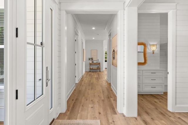 hall with recessed lighting, baseboards, crown molding, and light wood finished floors