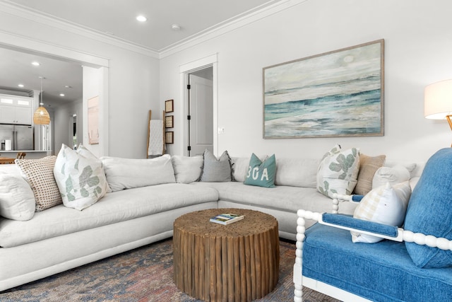 living area featuring recessed lighting and crown molding