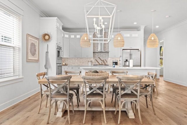 kitchen featuring a kitchen island with sink, stainless steel appliances, glass insert cabinets, backsplash, and a chandelier