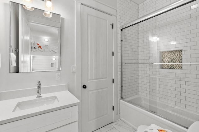 full bathroom featuring bath / shower combo with glass door, marble finish floor, and vanity