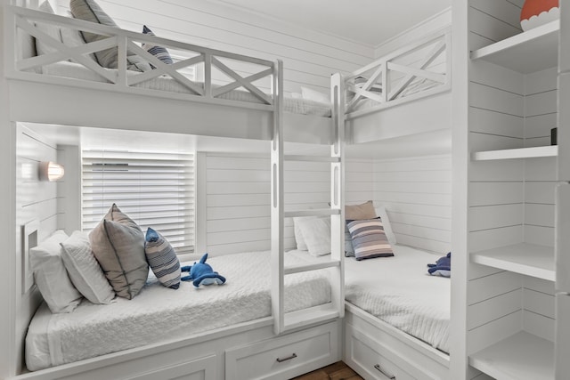 bedroom with wooden walls