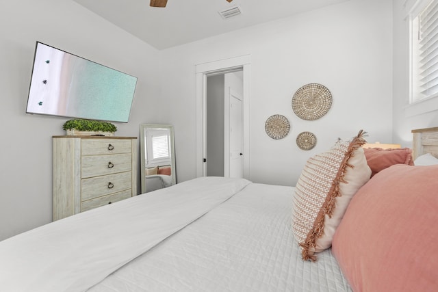 bedroom with visible vents and a ceiling fan