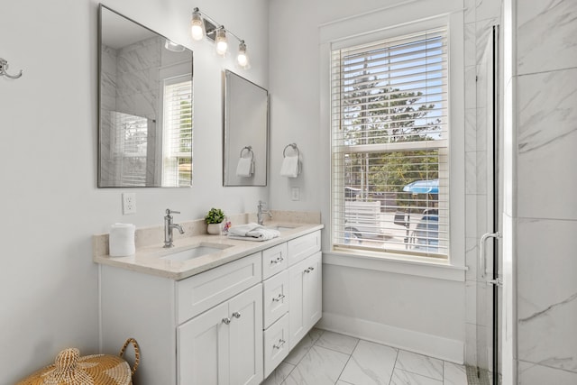 bathroom featuring double vanity, baseboards, marble finish floor, and a sink