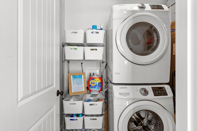 washroom featuring stacked washer and dryer