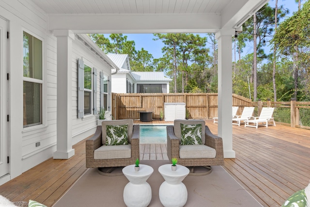 wooden deck featuring fence