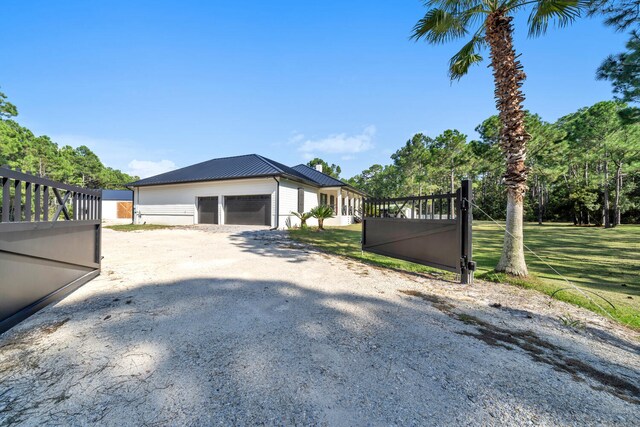 exterior space with a front yard and a garage