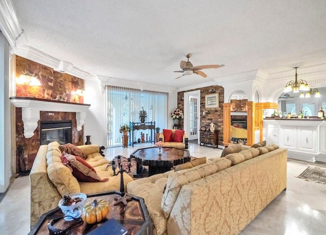 living room featuring ceiling fan with notable chandelier, crown molding, and a textured ceiling