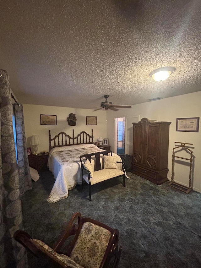 carpeted bedroom with a textured ceiling and ceiling fan