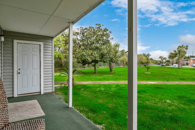 exterior space featuring carpet flooring and expansive windows