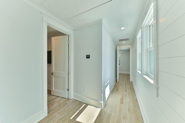 hall featuring light hardwood / wood-style flooring and a wealth of natural light