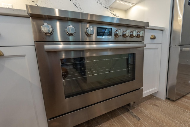 room details with stainless steel appliances and light wood-type flooring