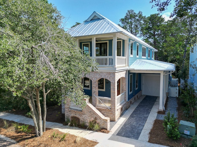 view of front of property featuring a garage and covered porch