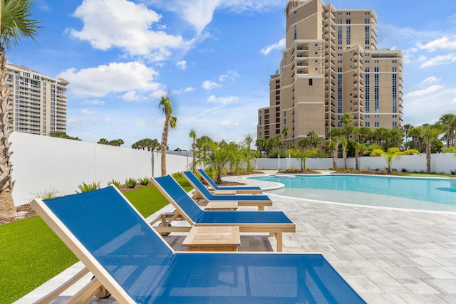 view of swimming pool with a patio area