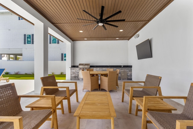 view of patio featuring ceiling fan, an outdoor kitchen, and outdoor lounge area