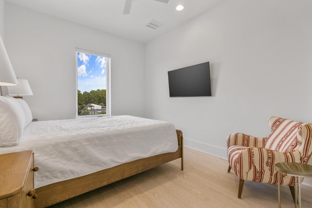 bedroom featuring light hardwood / wood-style flooring and ceiling fan