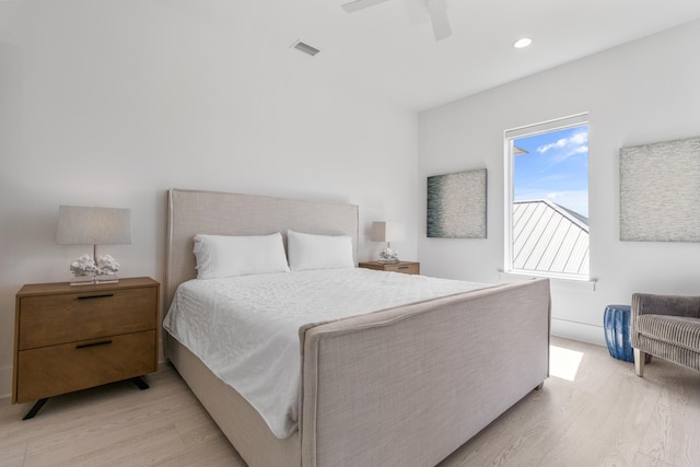 bedroom with light hardwood / wood-style floors and ceiling fan