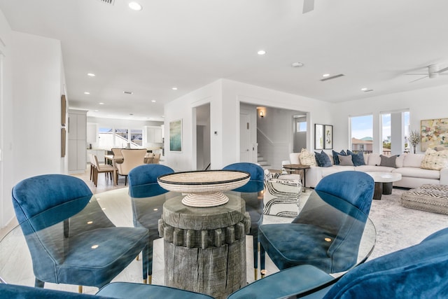 living room with ceiling fan and light hardwood / wood-style floors